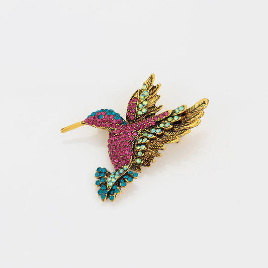 24k gold-plated brooch in the shape of bird with colorful crystals - beautiquepoint.com