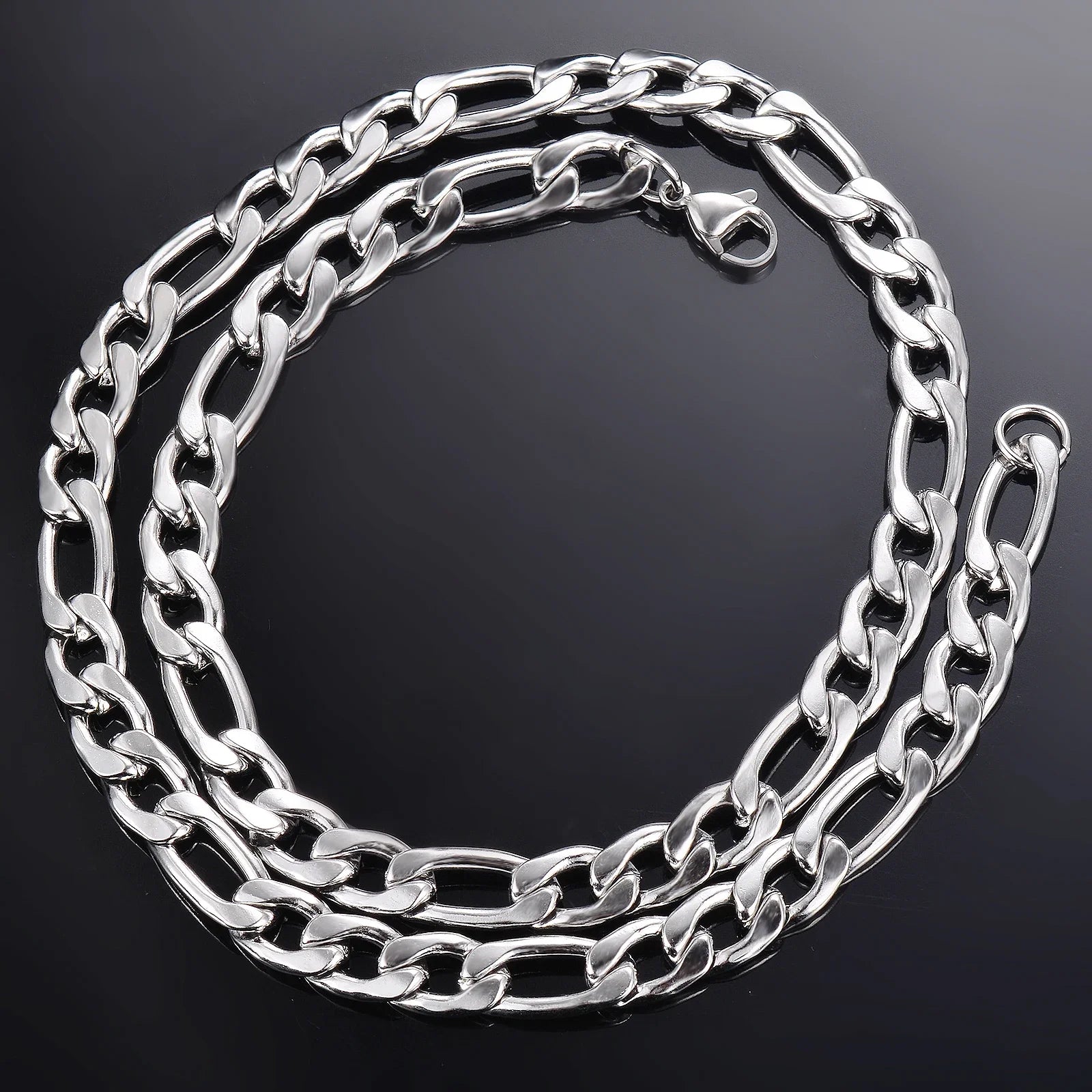 Coiled classic silver-tone chain necklace on dark background