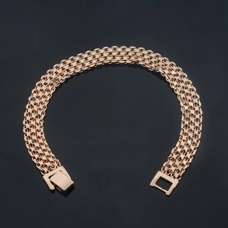 Rose gold woven bracelet displayed in curved shape on black background