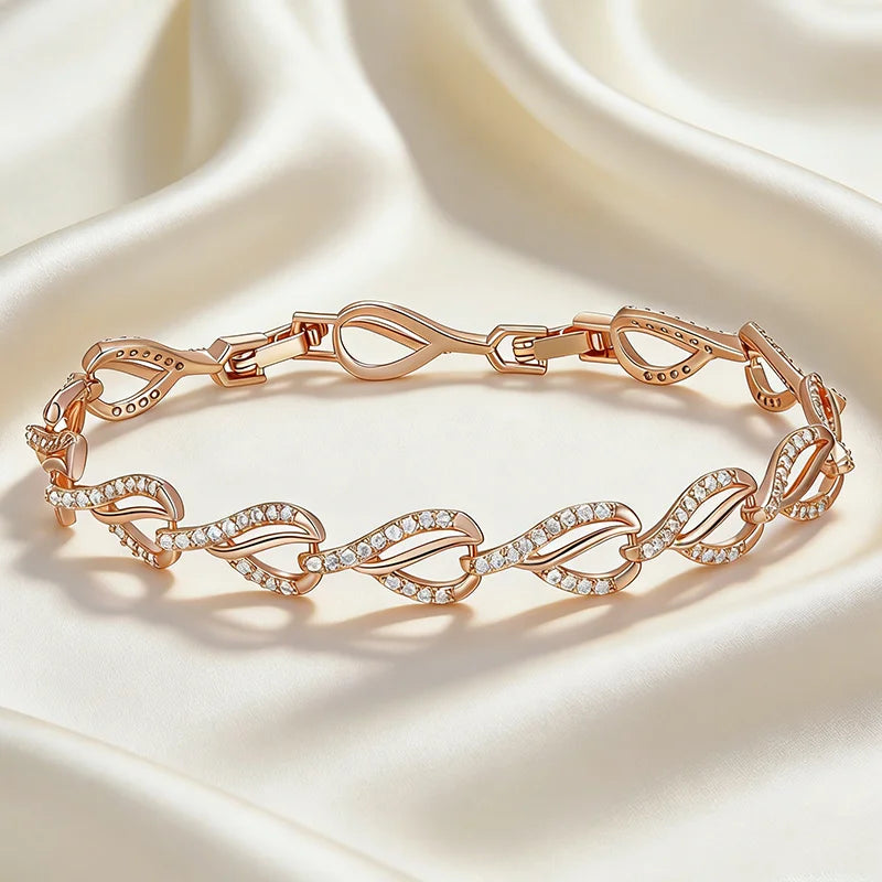 Close-up of rose gold heart bracelet with cubic zircon accents