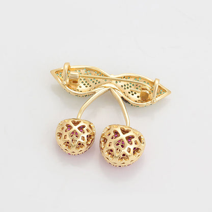 The back of the 14K gold-plated brooch in the shape of two cherries designed with colorful crystals - beautiquepoint.com